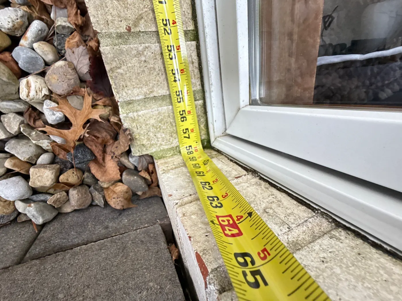 Storm-damaged window documented in Heartland Crossing